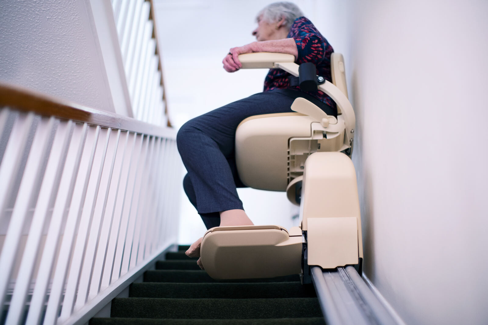 A stairlift on the staircase of a warm and welcoming British home